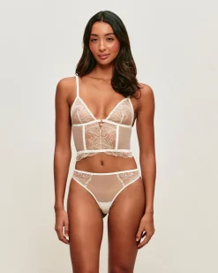 Guêpière en mesh avec broderies florales et pendentif perle