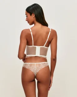 Guêpière en mesh avec broderies florales et pendentif perle