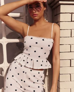 Pantalon matière texturée motifs à pois