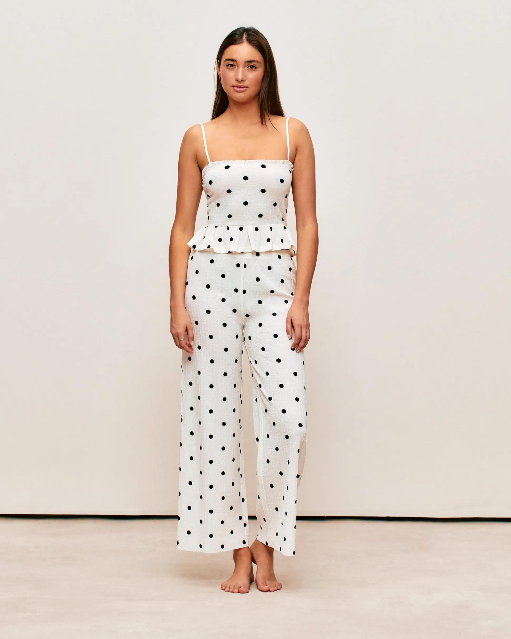 Pantalon matière texturée motifs à pois